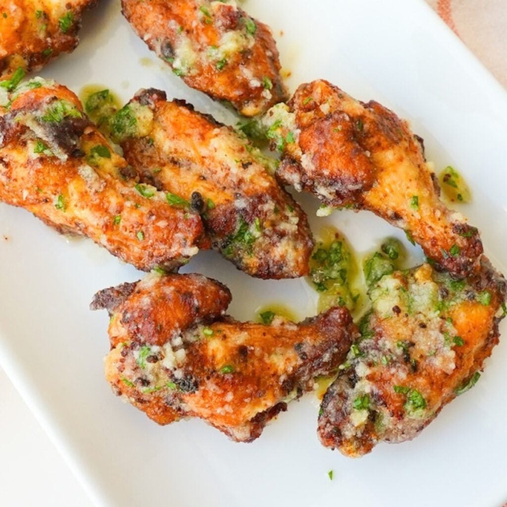 Crispy garlic parmesan wings coated with garlic butter, grated Parmesan, and chopped fresh parsley.