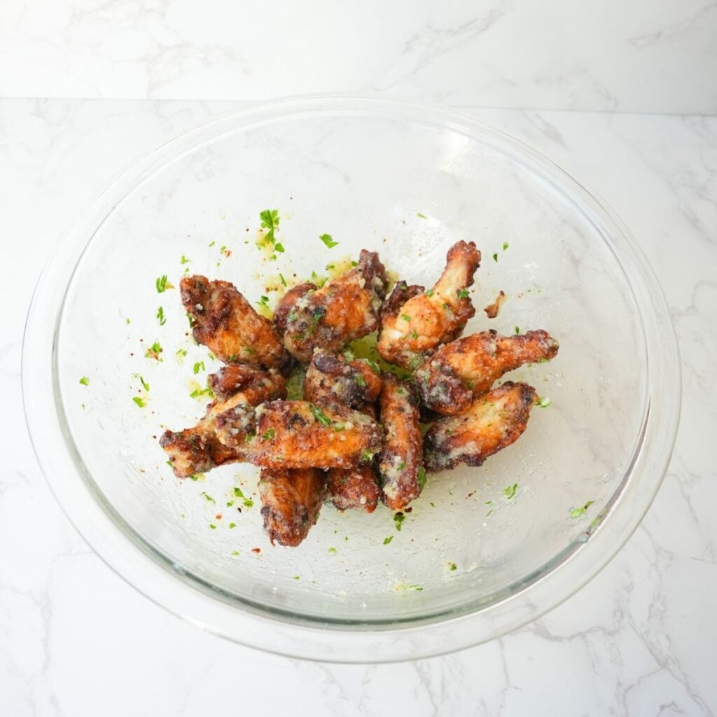 Crispy garlic parmesan wings coated with garlic butter, grated Parmesan, and chopped fresh parsley.
