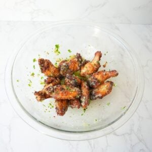Crispy garlic parmesan wings coated with garlic butter, grated Parmesan, and chopped fresh parsley.