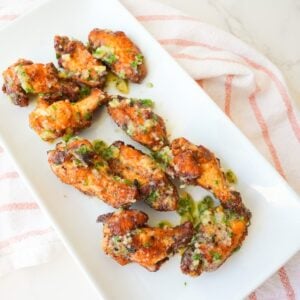 Crispy garlic parmesan wings coated with garlic butter, grated Parmesan, and chopped fresh parsley.