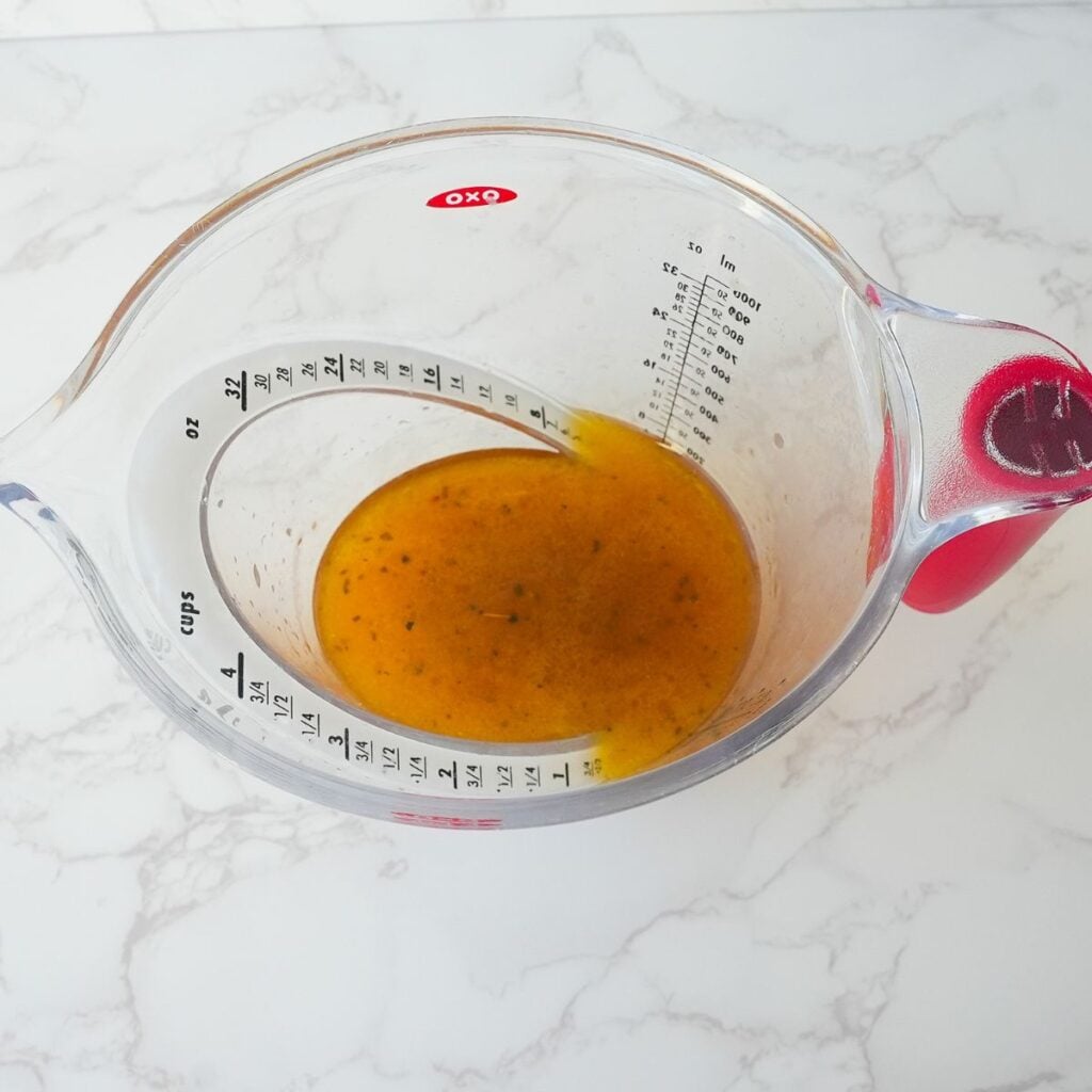 Pan drippings in a measuring cup.